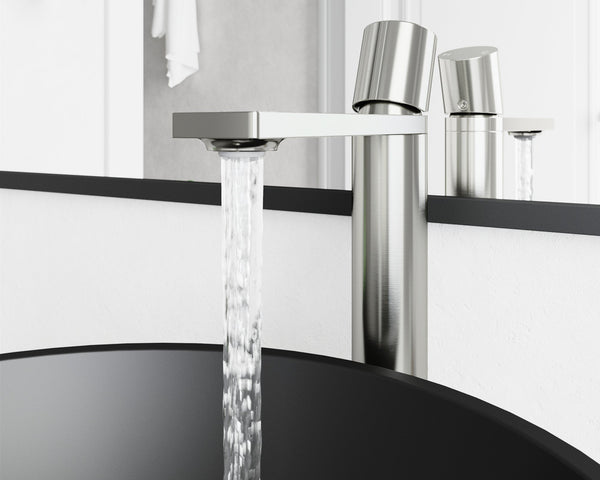 A tall single-hole vessel faucet arcing over a raised basin on a bathroom vanity