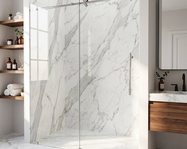 Frameless glass sliding shower door with chrome hardware in a bright, modern tiled bathroom