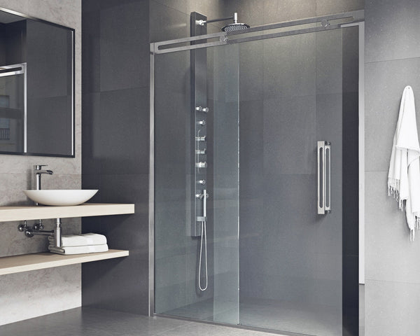 Elegant marble bathroom featuring a bathtub, sink, and glass shower enclosure.