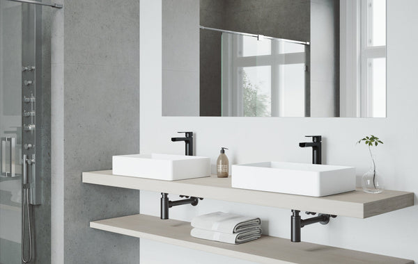Elegant bathroom featuring a bathtub and mosaic-tiled walls in a contemporary design.