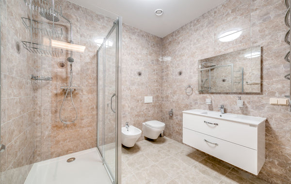 Contemporary bathroom featuring a glass shower and sleek fixtures in a minimalist design.