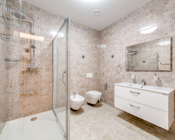 Contemporary bathroom featuring a glass shower and sleek fixtures in a minimalist design.