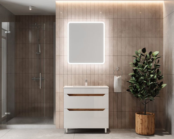 Elegant beige-tiled bathroom with illuminated mirror and potted plant accent.