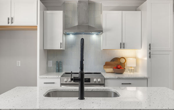 Contemporary kitchen featuring marble countertops and stylish cabinetry for a sophisticated look.