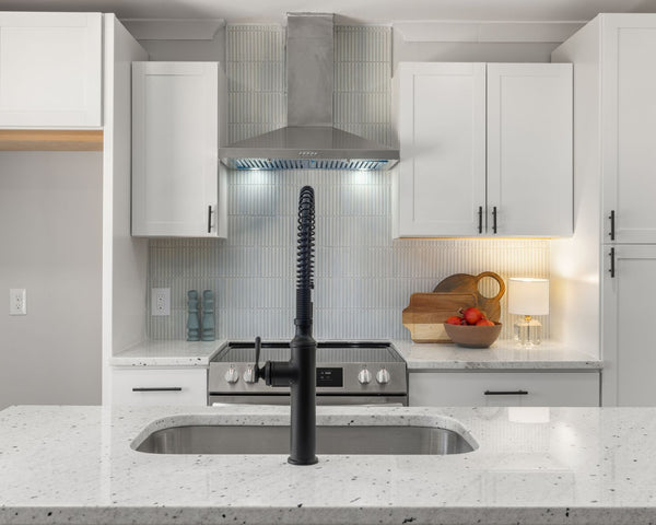 Contemporary kitchen featuring marble countertops and stylish cabinetry for a sophisticated look.
