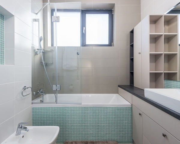 A sleek and contemporary bathroom featuring minimalist design and modern amenities.