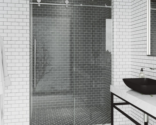 Frameless glass sliding shower door with clear tempered glass in a bright, modern bathroom
