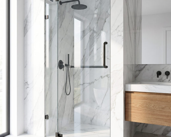 VIGO Pirouette frameless pivot shower door with matte black hardware in a marble shower alcove