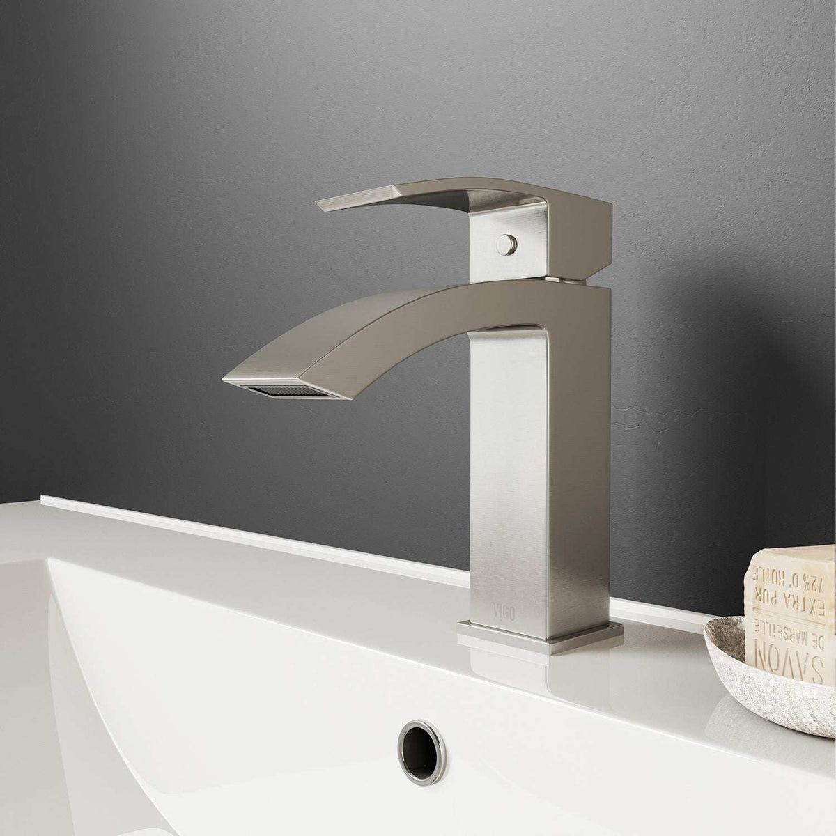 Brushed nickel single hole bathroom faucet with lever handle and waterfall spout