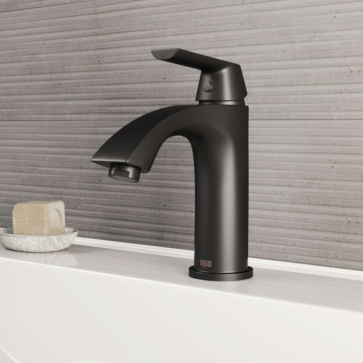 VIGO Penela matte black single-hole bathroom faucet with curved spout and lever handle, installed in modern bathroom