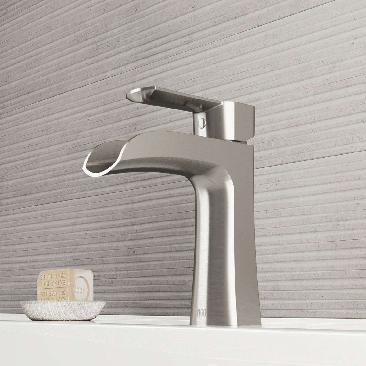 Brushed nickel single hole bathroom faucet with lever handle and waterfall spout