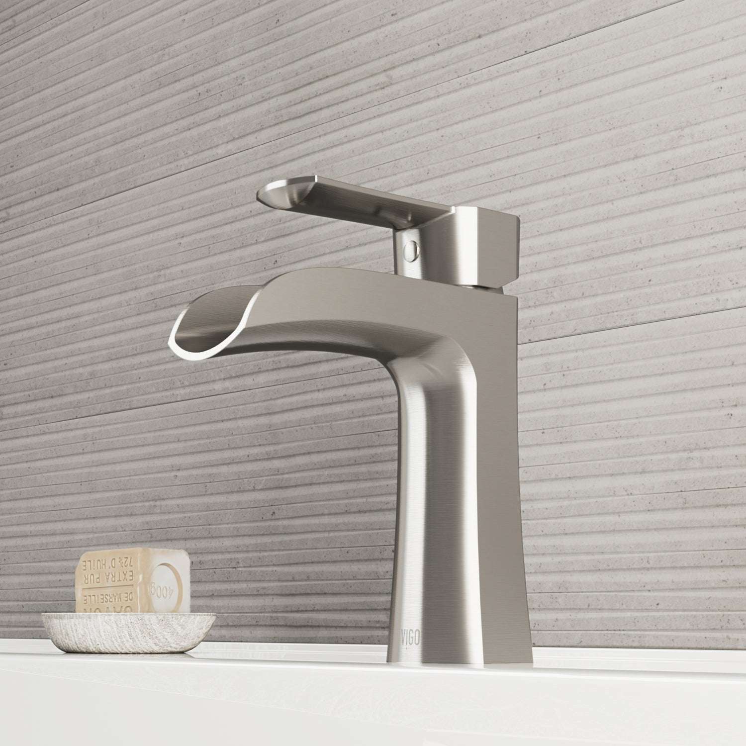 Brushed nickel single hole bathroom faucet with lever handle and waterfall spout