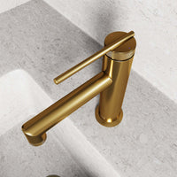 Deck-mounted faucet with ceramic disk valve and matte brushed gold finish