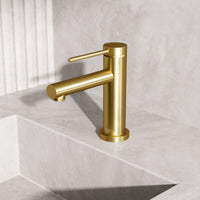 Modern deck-mounted faucet in matte brushed gold with ceramic disc cartridge