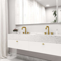 Modern deck-mounted 3-hole faucet in matte brushed gold with knob handles and low flow