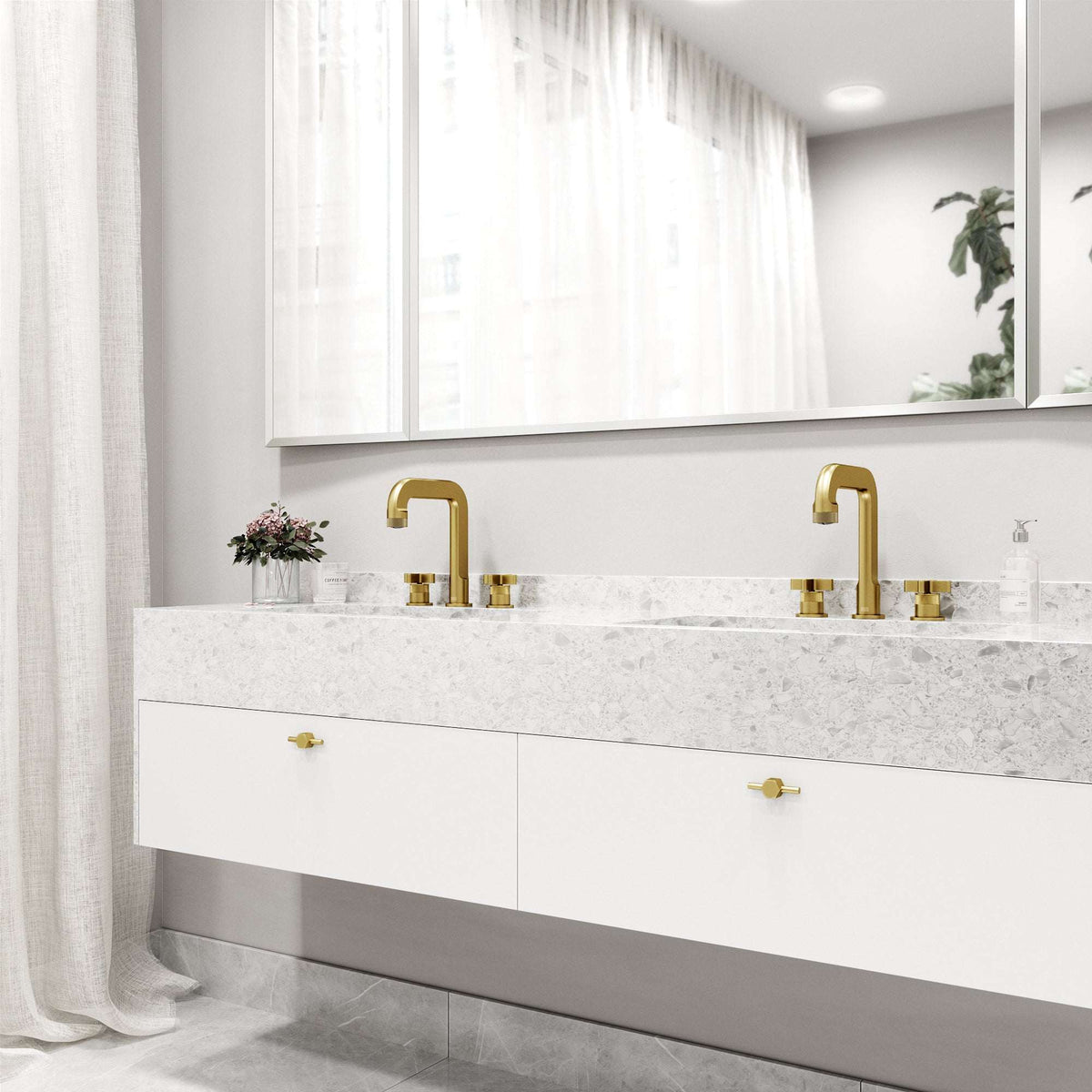 Modern deck-mounted 3-hole faucet in matte brushed gold with knob handles and low flow