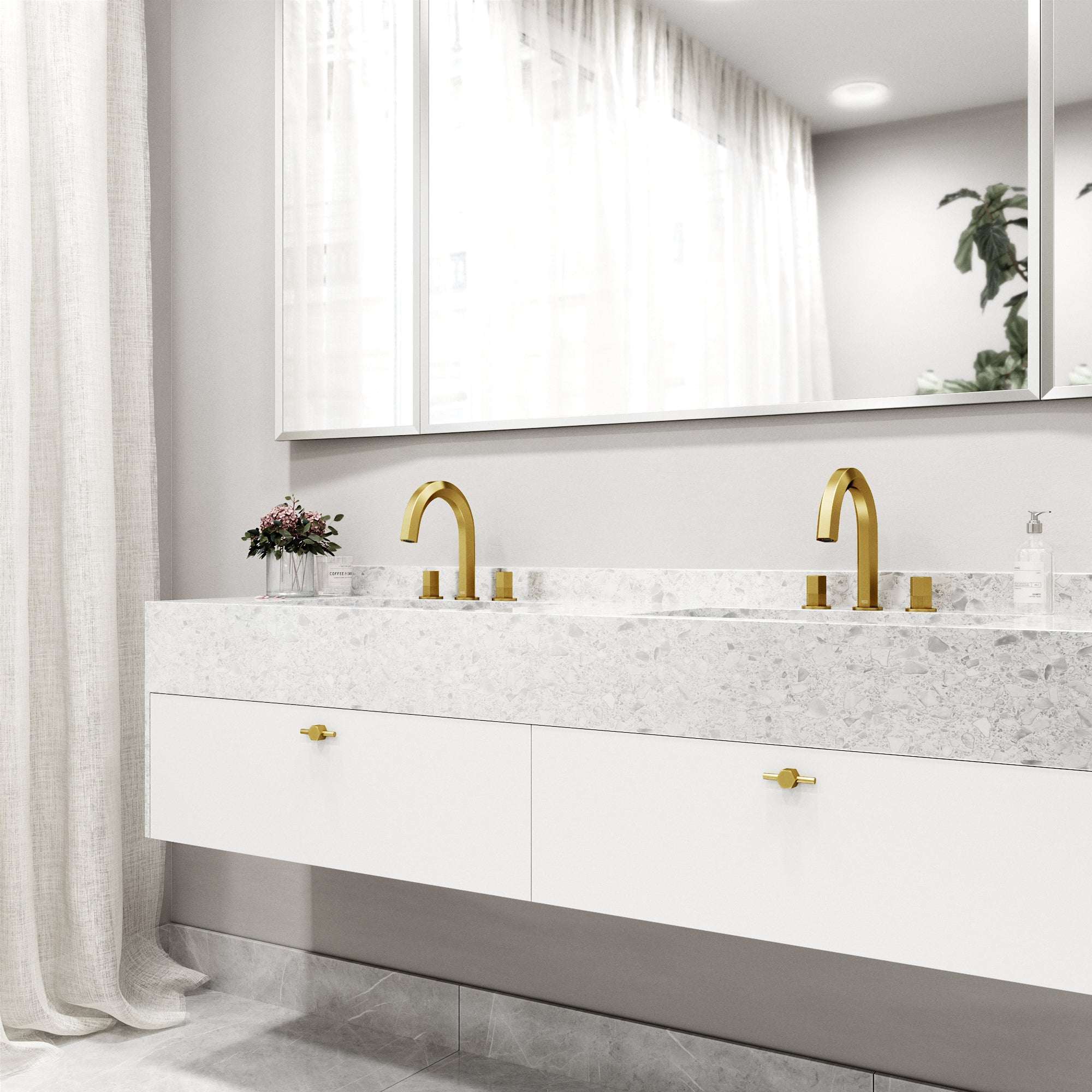 Modern 3-hole deck mounted faucet in matte brushed gold with knob handles and low flow