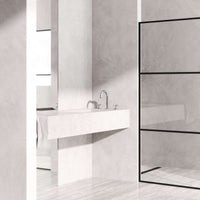 Widespread bathroom faucet featuring waterfall flow and brushed nickel finish