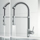 Modern chrome kitchen faucet featuring 360-degree swivel spout and docking station