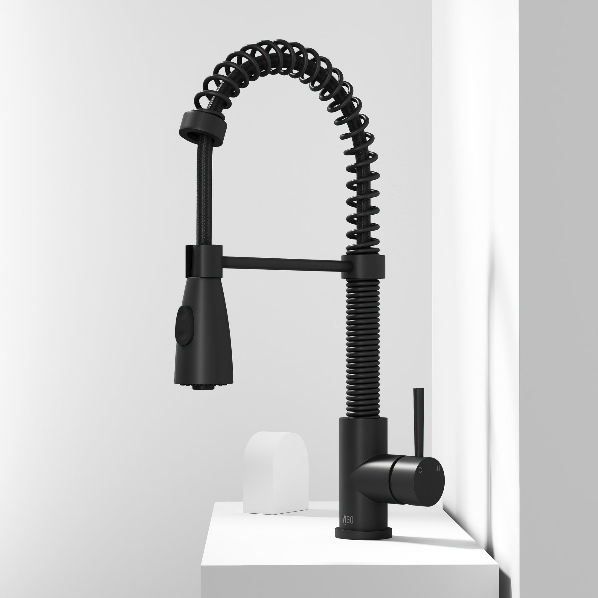 Matte black single handle kitchen faucet with pull-down sprayer and gooseneck spout