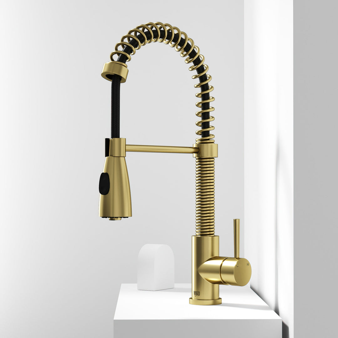 Brass kitchen faucet with matte brushed gold finish and 360-degree spout swivel