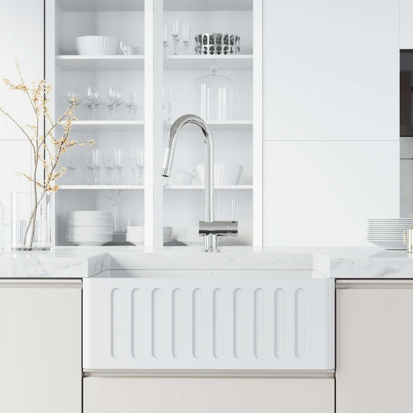Deck-mounted chrome faucet featuring pull-down sprayer and secure docking station