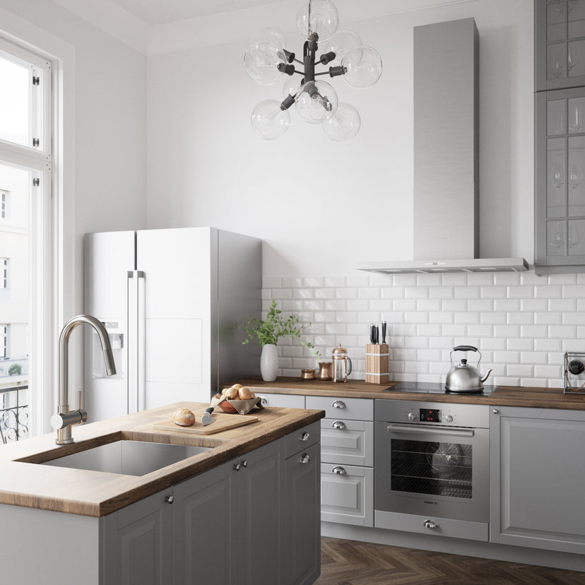Brass kitchen faucet with stainless steel finish and included supply lines