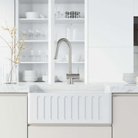 Deck-mounted stainless steel faucet with pull-down sprayer and swivel spout