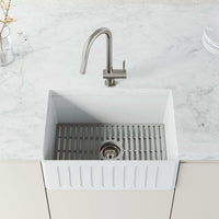Stainless steel kitchen faucet with 360-degree spout swivel and secure docking