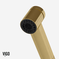 Pull-out kitchen faucet in matte brushed gold with secure docking station