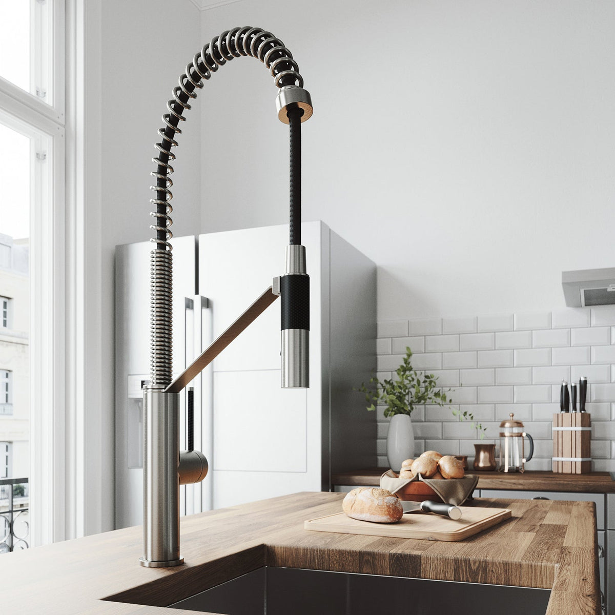 Kitchen faucet with magnetic docking station, pre-rinse function, and stainless steel finish