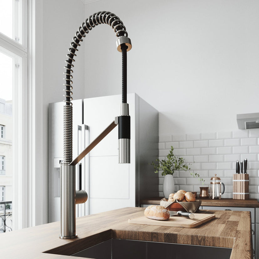 Kitchen faucet with magnetic docking station, pre-rinse function, and stainless steel finish