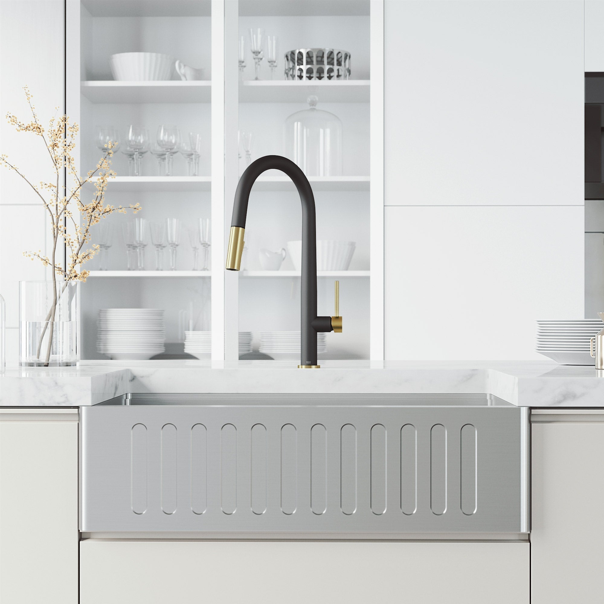 Kitchen faucet with ceramic disc valve, black and gold finish, and dual-mode sprayer