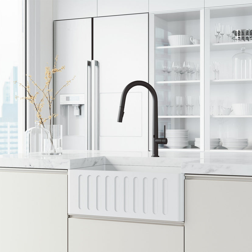 High-arc matte black faucet with lever handle and included supply lines and hardware