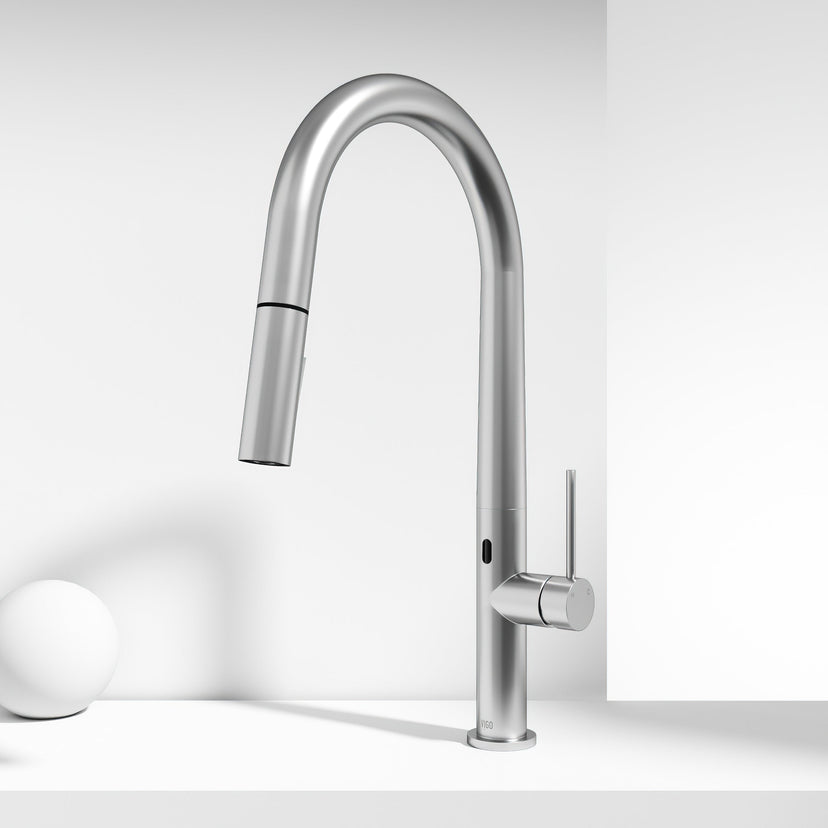 Brass kitchen faucet with high-arc spout and touchless sensor for modern kitchens