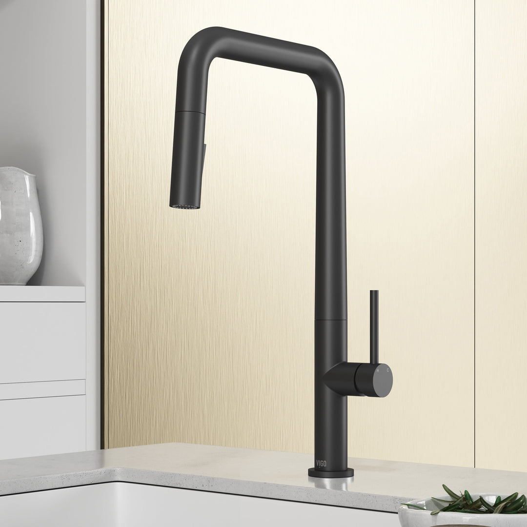 Matte black single handle kitchen faucet with pull-down sprayer and high-arc gooseneck spout