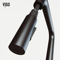 Pull-down kitchen faucet in matte black finish featuring secure docking and spot-resistant surface