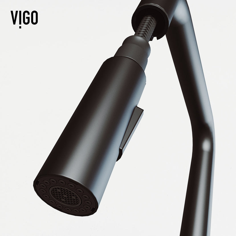 Pull-down kitchen faucet in matte black finish featuring secure docking and spot-resistant surface