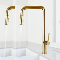 High-arc gooseneck faucet with brushed gold finish and included supply lines and sprayer