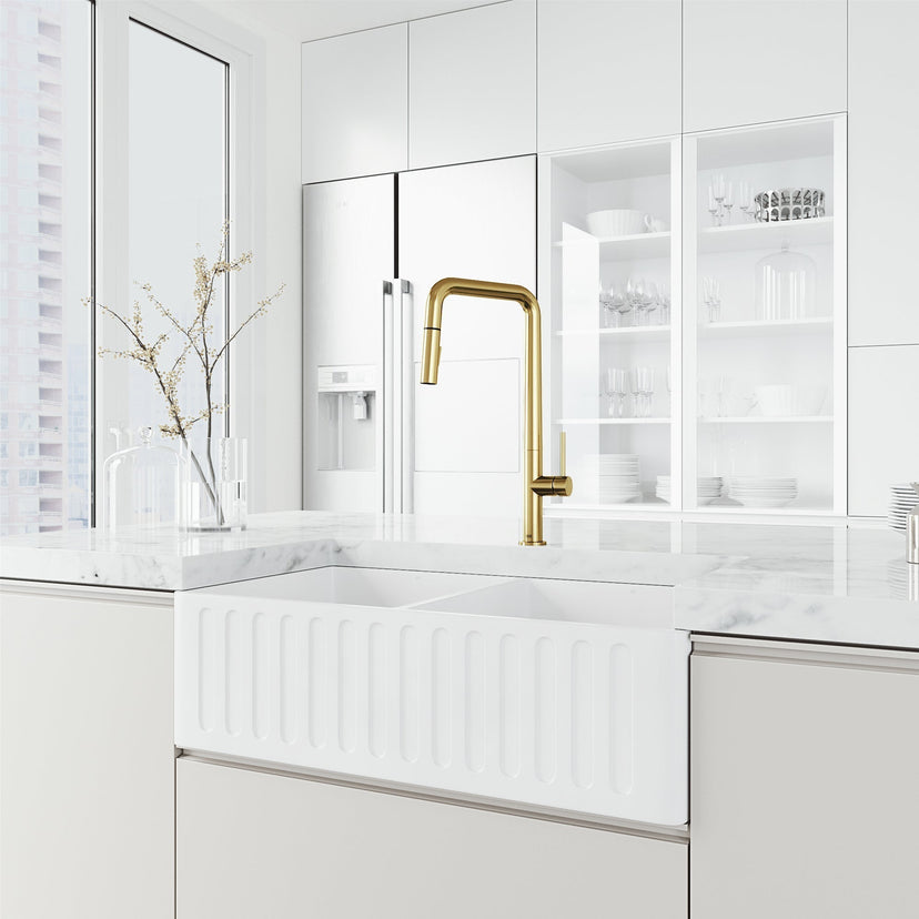 Matte brushed gold kitchen faucet with pre-rinse function and included hose and mounting materials