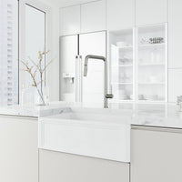 Stainless steel kitchen faucet with pre-rinse function and included hose and mounting materials