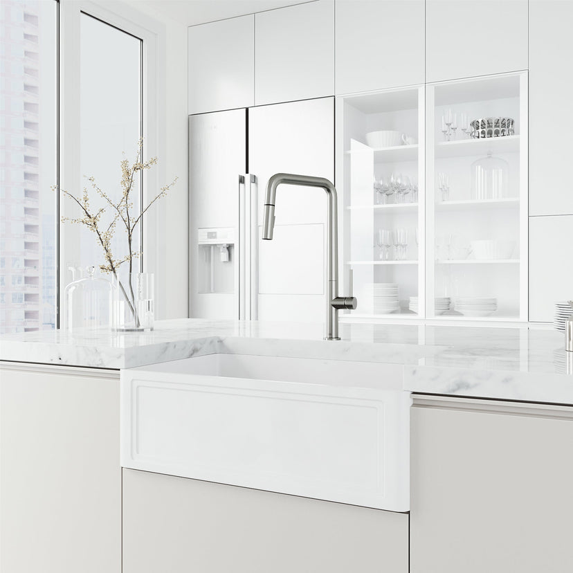 Stainless steel kitchen faucet with pre-rinse function and included hose and mounting materials