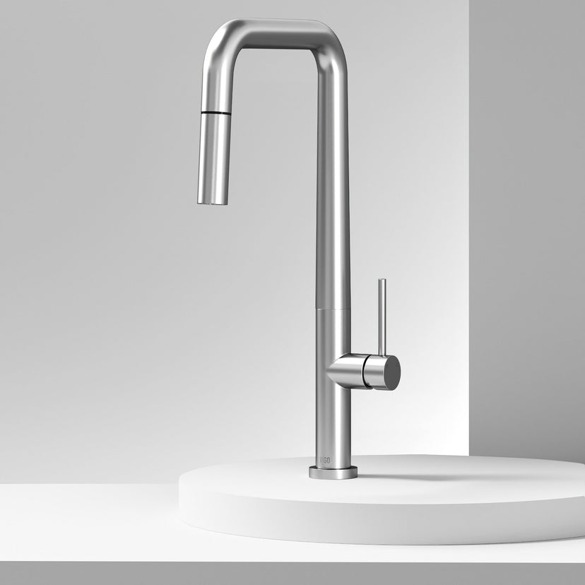 Single handle kitchen faucet featuring secure docking and 360-degree spout rotation