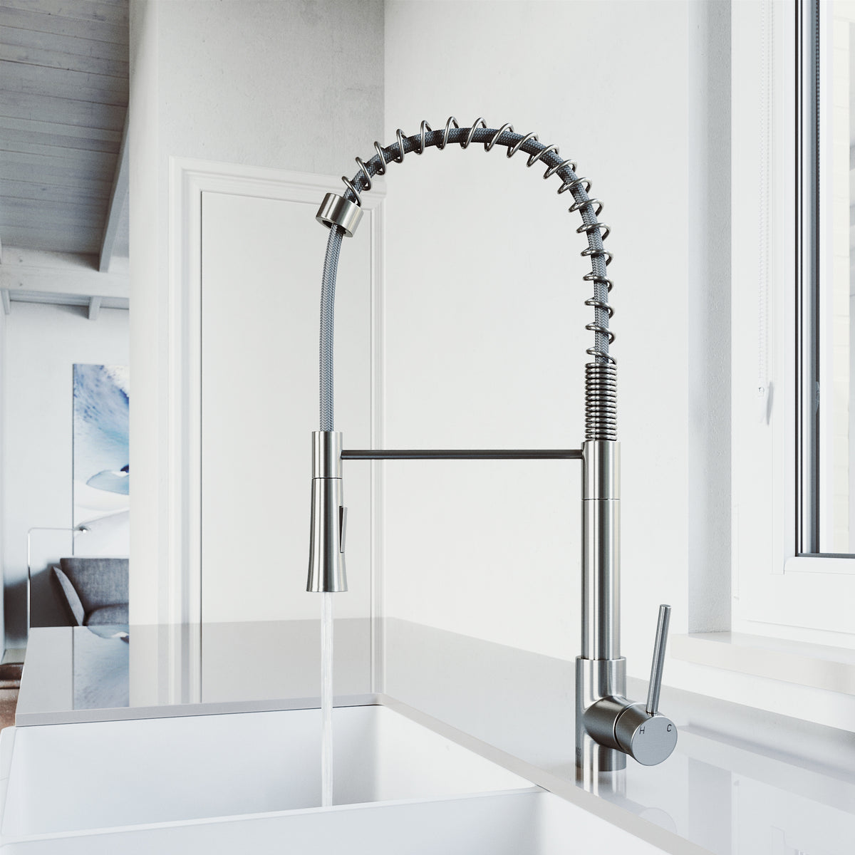 Pull-down kitchen faucet with secure docking station and spot-resistant stainless steel finish