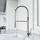 Pull-down kitchen faucet with secure docking station and spot-resistant stainless steel finish