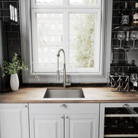 Deck-mounted kitchen faucet with ceramic valve, pull-down sprayer, and stainless steel finish