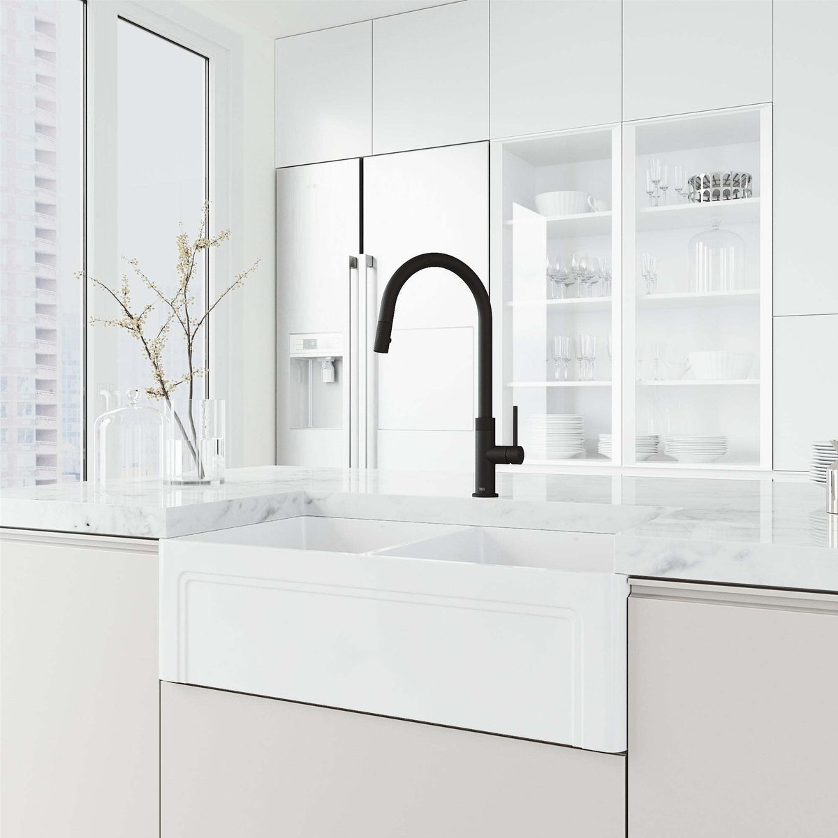 Brass construction kitchen faucet in matte black with included hose and sprayer