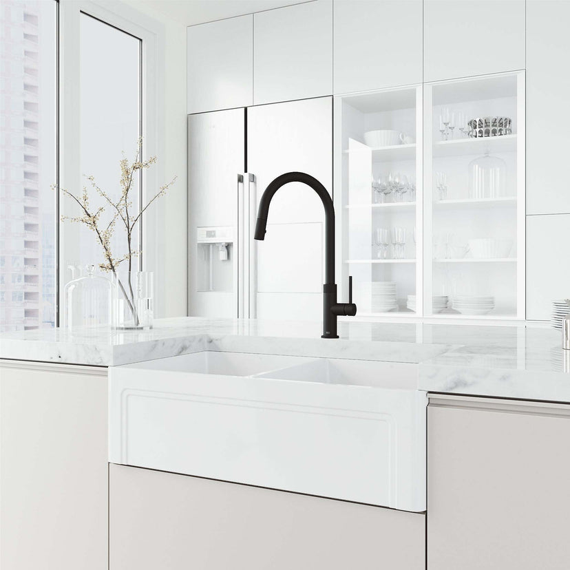 Brass construction kitchen faucet in matte black with included hose and sprayer