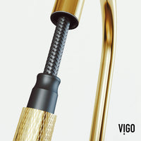 Spot-resistant matte brushed gold faucet with secure docking and pre-rinse