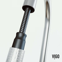 Spot-resistant stainless steel faucet with secure docking and pre-rinse
